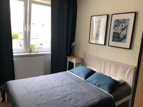Posteľ alebo postele v izbe v ubytovaní Umi Apartament