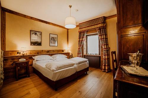 Un ou plusieurs lits dans un hébergement de l'établissement Hotel Jumeaux