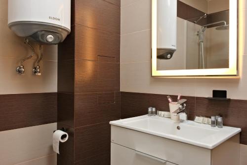 Ett badrum på Апартамент за гости Дарива