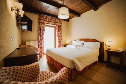 Postel nebo postele na pokoji v ubytování Hotel Jumeaux