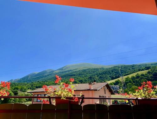 a view from the balcony of a house with mountains in the background at Hotel Edelweiss in San Zeno di Montagna