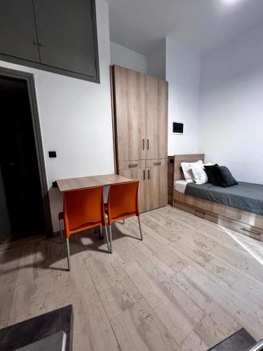a room with a bed and a desk and a bed at Central Single Room Ground floor in Heraklio