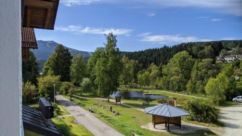 a view of a lake with a gazebo at Ferienwohnung Grenzenblick in Bayerisch Eisenstein