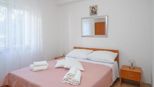 Postel nebo postele na pokoji v ubytování Apartments Tamaris