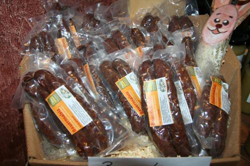 a box of chocolate covered donuts in plastic bags at Hotel Helvetia in Müstair