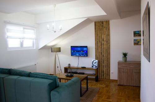 TV a/nebo společenská místnost v ubytování Apartman MIA Centar