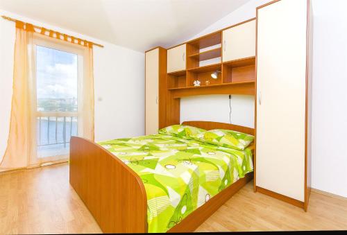 Postel nebo postele na pokoji v ubytování Apartment Smiljana