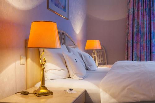 Ein Bett oder Betten in einem Zimmer der Unterkunft Hotel Residenz Joop