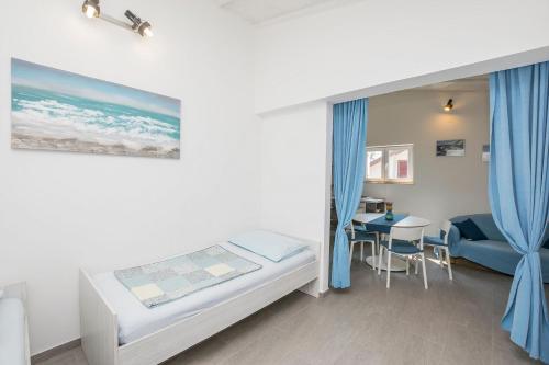 Postel nebo postele na pokoji v ubytování Apartments Mira