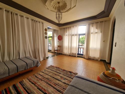 a living room with a couch and a rug at Targafit Hotel & Hammam in Marrakech