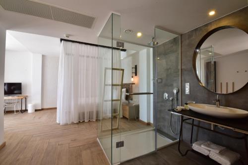 a bathroom with a sink and a mirror at Moon Beach&Hotel in Bodrum City