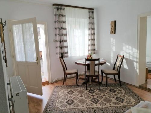 a small dining room with a table and chairs at Pensiunea Spack in Cristian