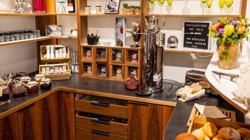 a shop with a counter with a blender on it at BC Hotel Bad Kreuznach mit Restaurant Mühlentor in Bad Kreuznach
