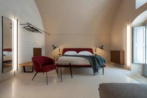 En eller flere senge i et værelse på PIANELLE RESORT