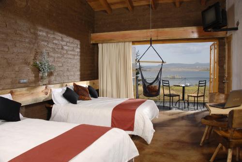 En eller flere senger på et rom på Hotel El Remanso Tapalpa