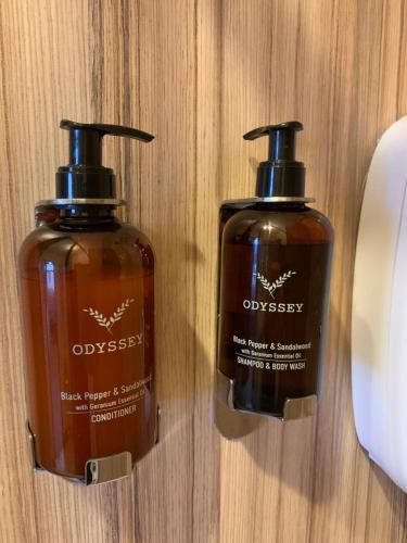 two bottles of oysesty soap sitting on a table at Rooms at The March Hare in Market Rasen