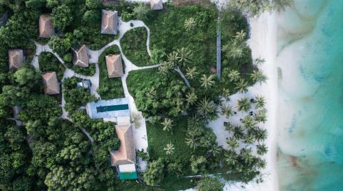 an aerial view of a resort with a pool and trees at Tamu Koh Rong in Koh Rong Island