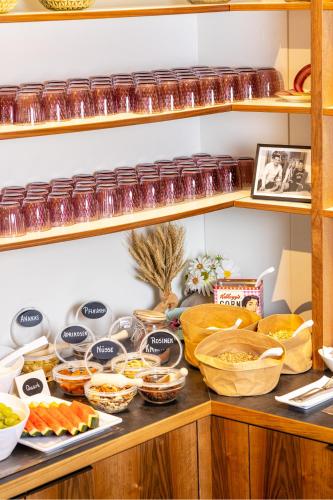 a shelf filled with different types of food at BC Hotel Bad Kreuznach mit Restaurant Mühlentor in Bad Kreuznach