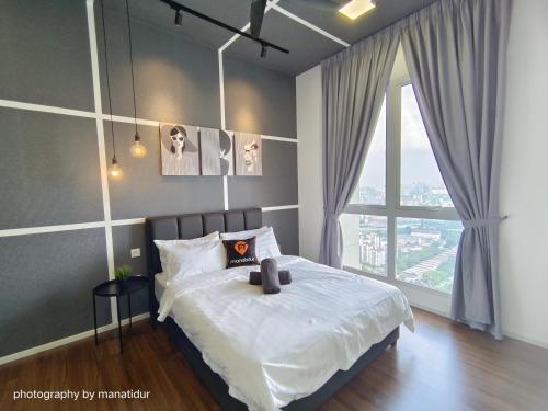 Кровать или кровати в номере UNA Serviced Apartment by manatidur
