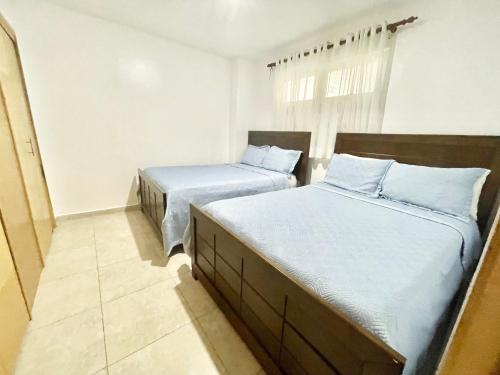 Ένα ή περισσότερα κρεβάτια σε δωμάτιο στο Marbella 2bedroom Beachfront Apartment