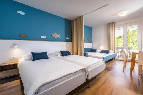Postelja oz. postelje v sobi nastanitve Bioenergy Resort Salinera Apartments