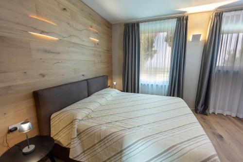 Postel nebo postele na pokoji v ubytování Eremus Relais