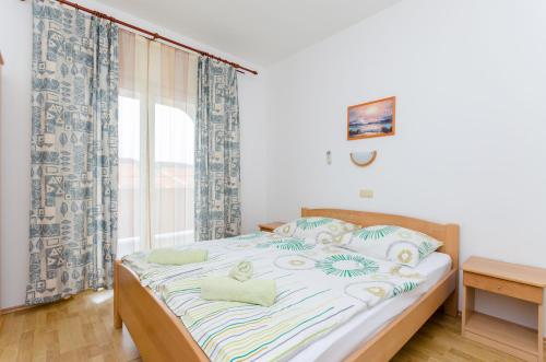 Posteľ alebo postele v izbe v ubytovaní Apartments and Room Ljubica