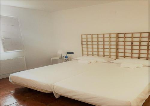 A bed or beds in a room at Hotel los Tilos