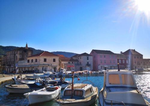 a group of boats are docked in a harbor at House Stone house Mia casa in Stari Grad