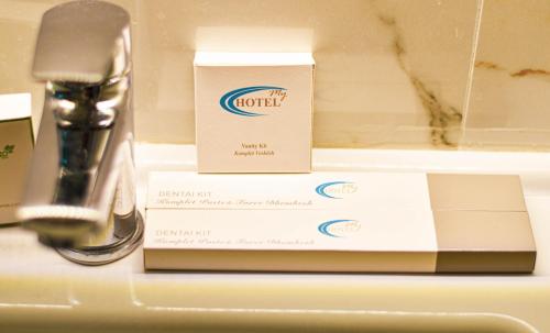 a box sitting on a counter next to a sink at HotelApart - DelMar in Durrës