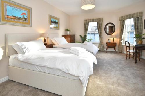 Giường trong phòng chung tại The Sutherland Arms