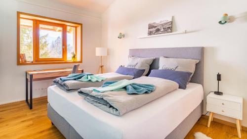 a bedroom with two beds with towels on them at Chalet im Winkl in Reit im Winkl