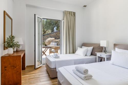 Cama o camas de una habitación en VILLA IFIGENEIA SKOPELOS με πισίνα και υπέροχη θέα