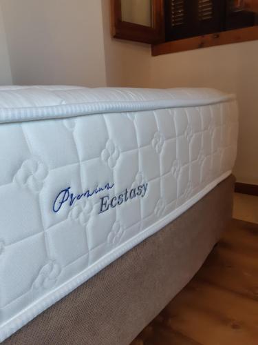 a mattress with the words planned decisions on it at Pyrgos Fassea Kardamyli Towerhouse in Kardamili