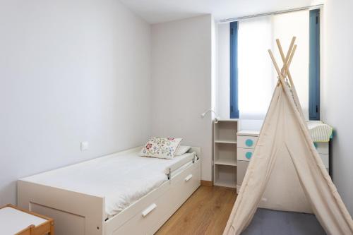 Posteľ alebo postele v izbe v ubytovaní Home2Book Executive & Design Las Torres