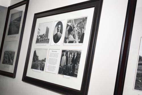 a framed picture offamous photographs hangs on a wall at Ayres Hotel Manhattan Beach in Hawthorne