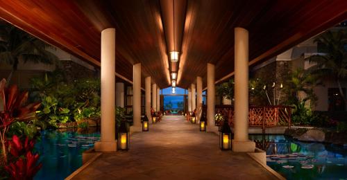 a lobby with a swimming pool and a resort at Montage Kapalua Bay in Kapalua