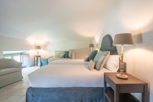 Кровать или кровати в номере Spinerola Hotel Restaurant e Spa Arborea