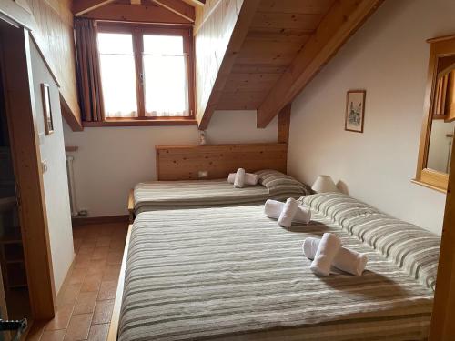 En eller flere senge i et værelse på Rifugio Predaia Ai Todes'ci