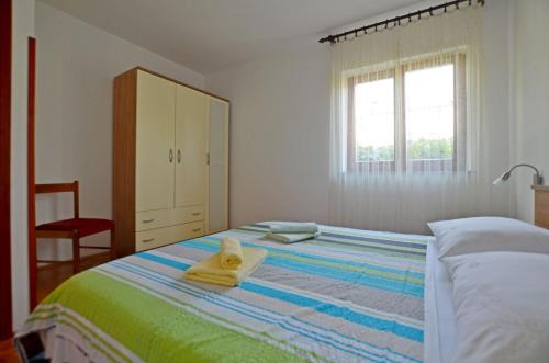 Cama ou camas em um quarto em Apartment Ljiljana