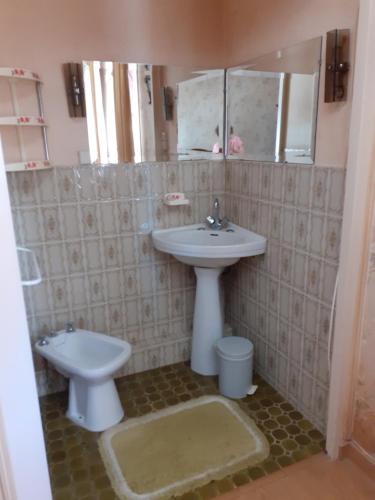 a bathroom with a sink and a toilet at le petit Forsitain in Fors