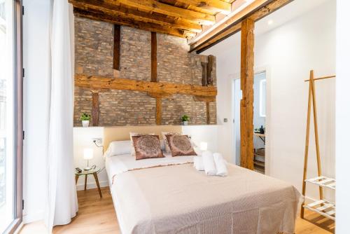 เตียงในห้องที่ Precioso apartamento en el centro de Granada