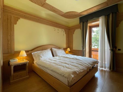 Ένα ή περισσότερα κρεβάτια σε δωμάτιο στο Hotel Cima Rosetta - BW Signature Collection