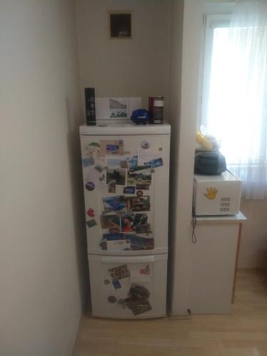 a refrigerator in a corner of a room at Byt 2+1 s balkonem in Vsetín