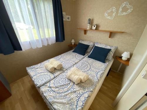 Postel nebo postele na pokoji v ubytování Hiška Štefi Velenjsko jezero