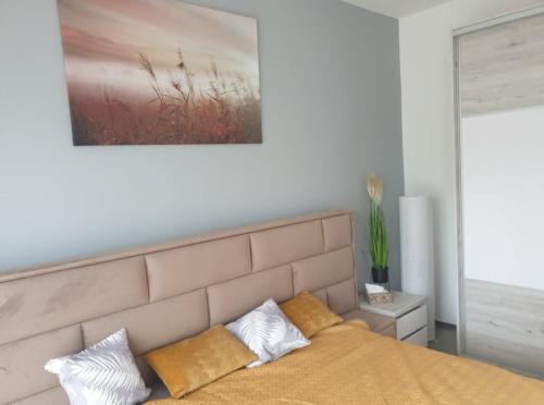 Posteľ alebo postele v izbe v ubytovaní Juventus Apartman