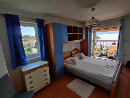 Postel nebo postele na pokoji v ubytování Sanda Residence