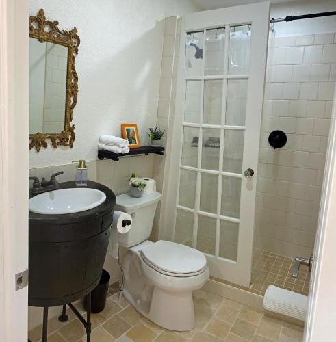 a bathroom with a toilet and a sink and a shower at Villa di Casa - Boutique Hotel in Wellington