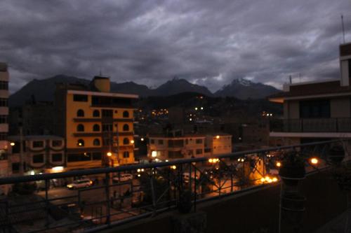 a view of a city at night with lights at Hotel Galaxia in Huaraz