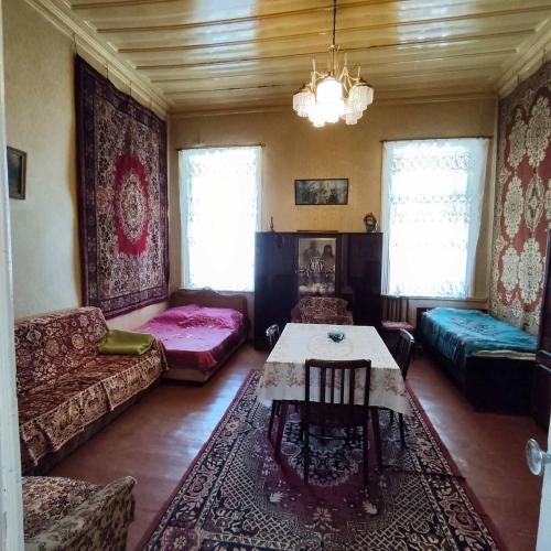 a living room with a couch and a table at Renting a full apartment in the centre of Gyumri in Gyumri